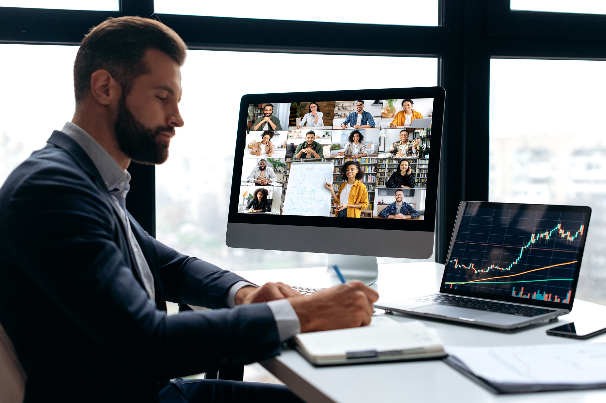 Motivated successful stock investor, trader, listens to an online webinar on the topic of trading